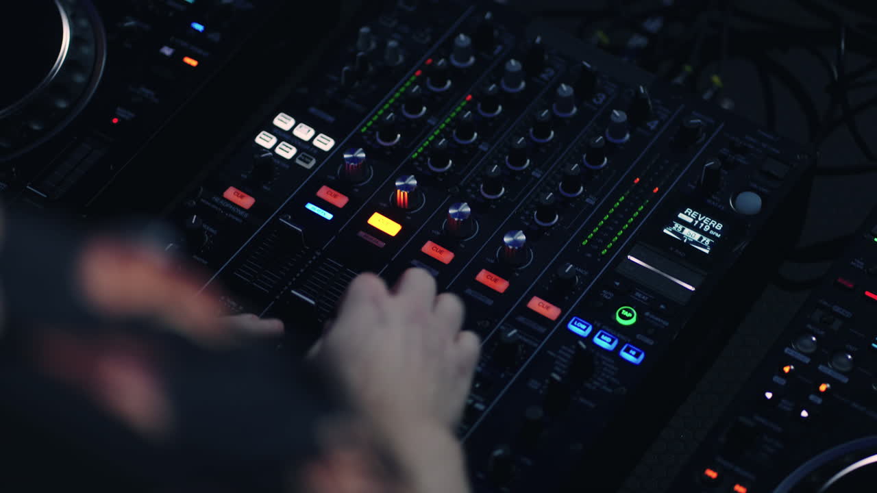 DJ mixing music on a mixer