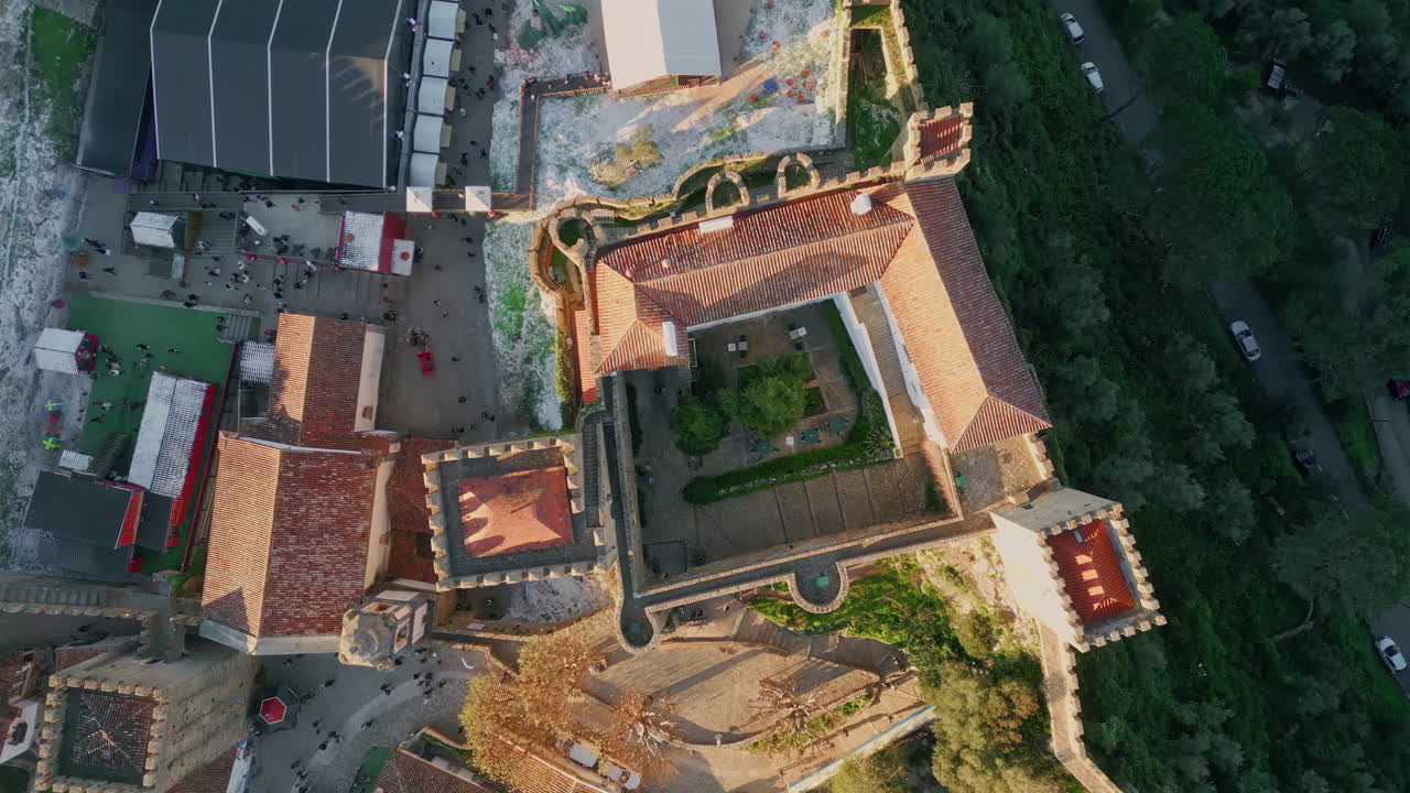 Top view castle towers surrounded buildings sunny evening. Historic architecture