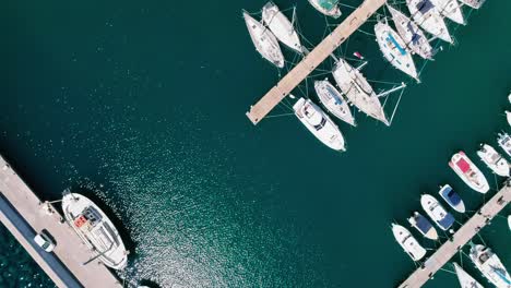 Drone-shot-over-the-marina,-seaside-boulevard,-beaches,-summer-in-Agios-Nikolaos-Crete-Greece