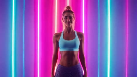 fit woman in sportswear with neon lights