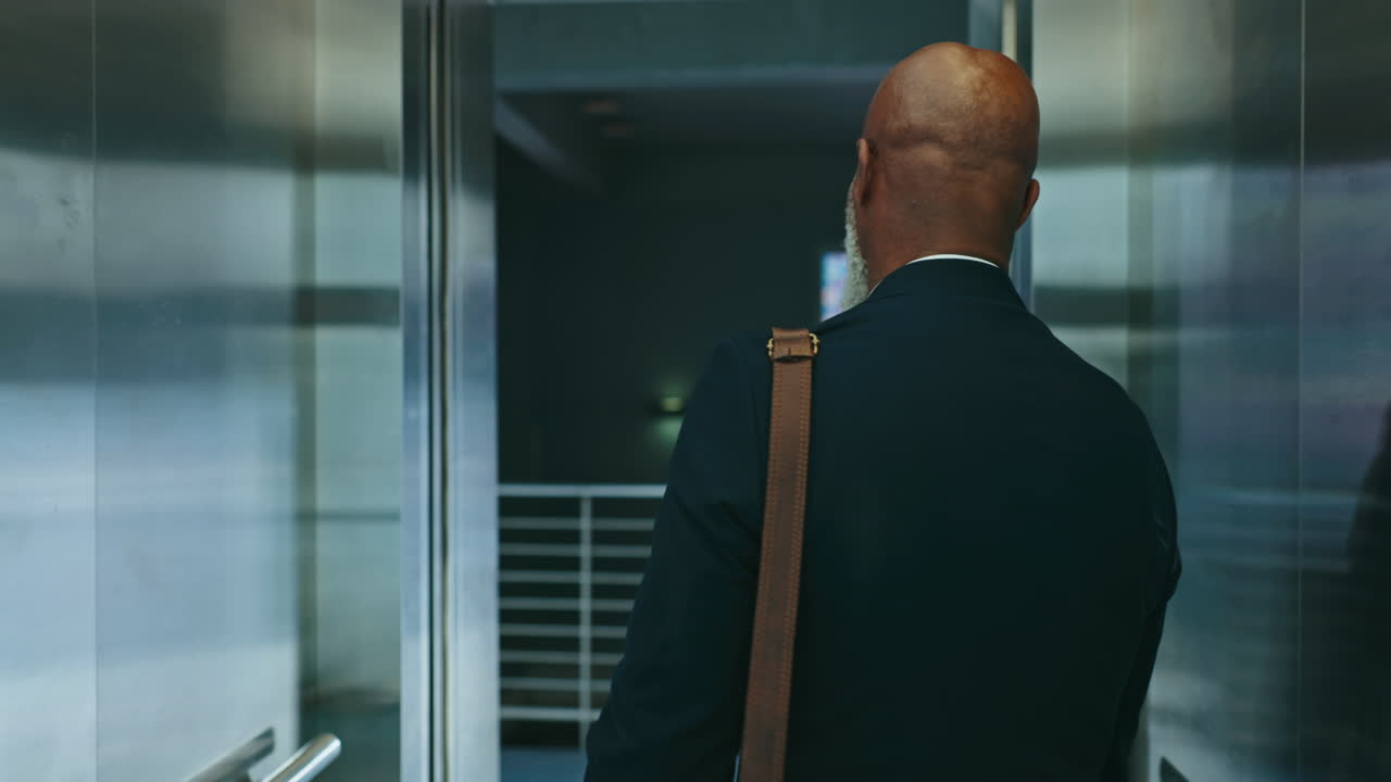 Business, man and elevator in office