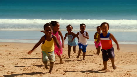 joyful children running on a sandy beach