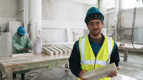 man examining marble