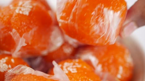 close up of orange ladoo sweets