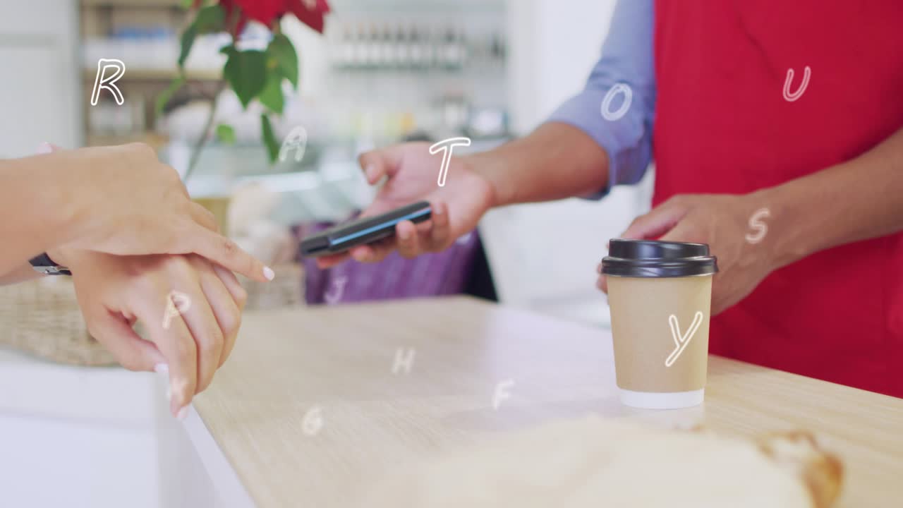 Patron placing hands on cafe counter barista holding terminal and cup patron aligning watch paying