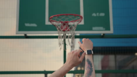 man shooting a basketball