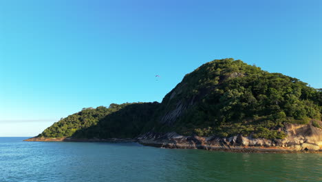 Island landscape with paragliding