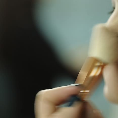 girl using makeup brush