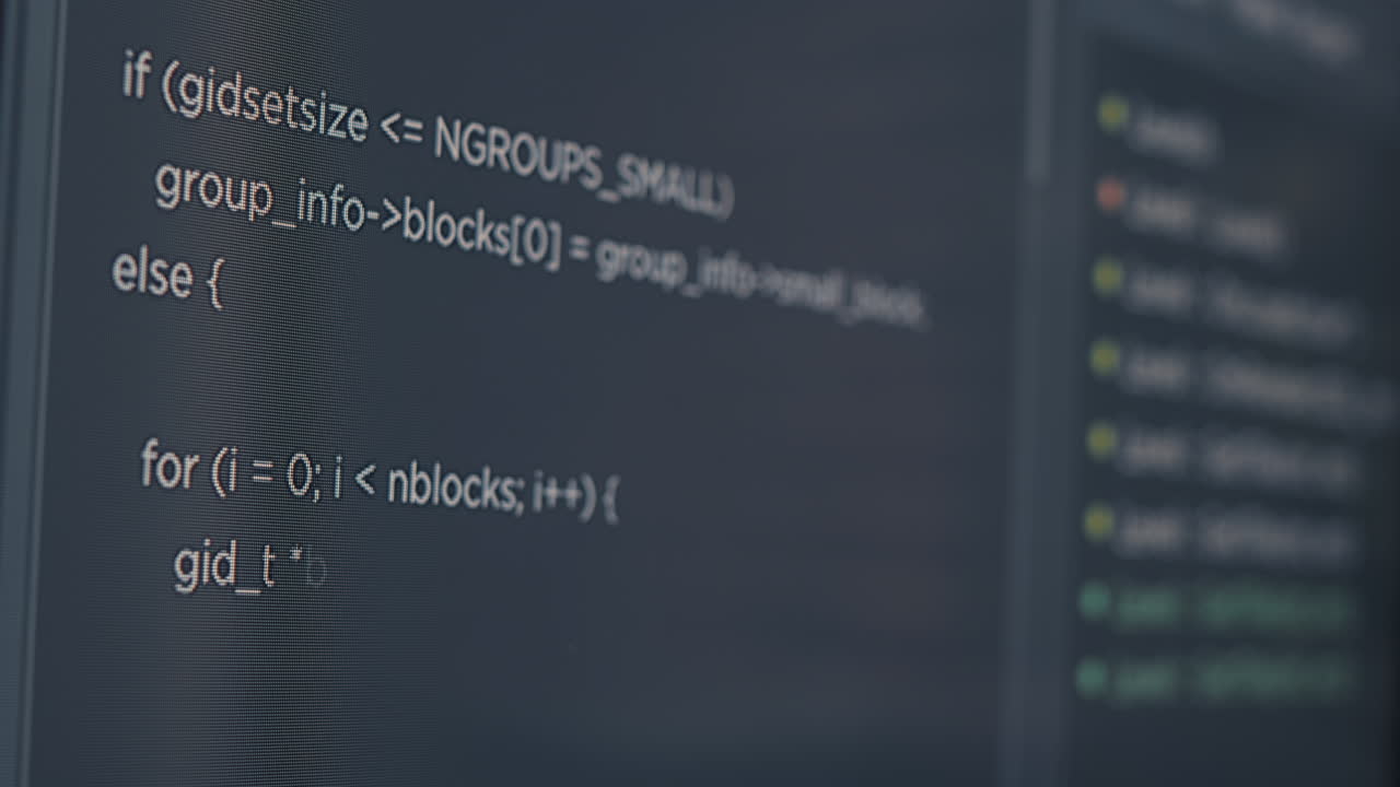 Closeup of computer screen of system engineer typing source code
