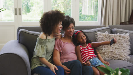 mixed race woman spending time with her mother and her daughter