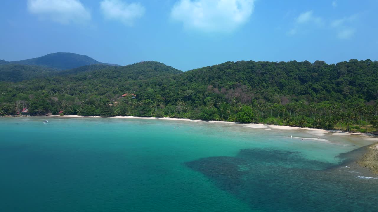 ong beach at koh chang island showing turquoise water and green rainforest in Trat Province, Thailand. Gorgeous aerial view flight panorama overview drone