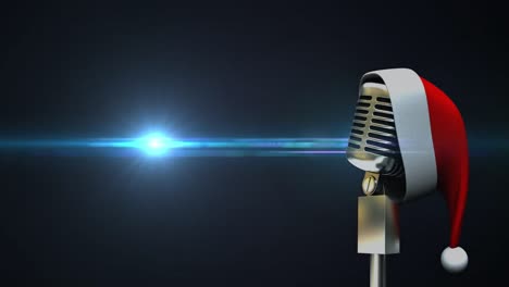 Microphone-with-Santa-hat-against-spot-of-light-moving-on-blue-background