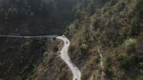 car driving in narrowed road in india himachal pradesh himalaya mountains remote forest natural aerial landscape