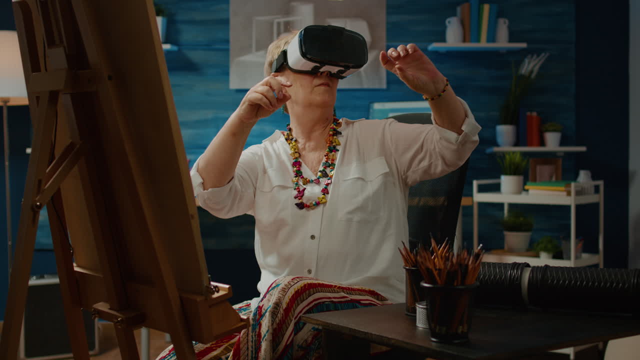 Senior artist using vr glasses with augmented reality to draw vase