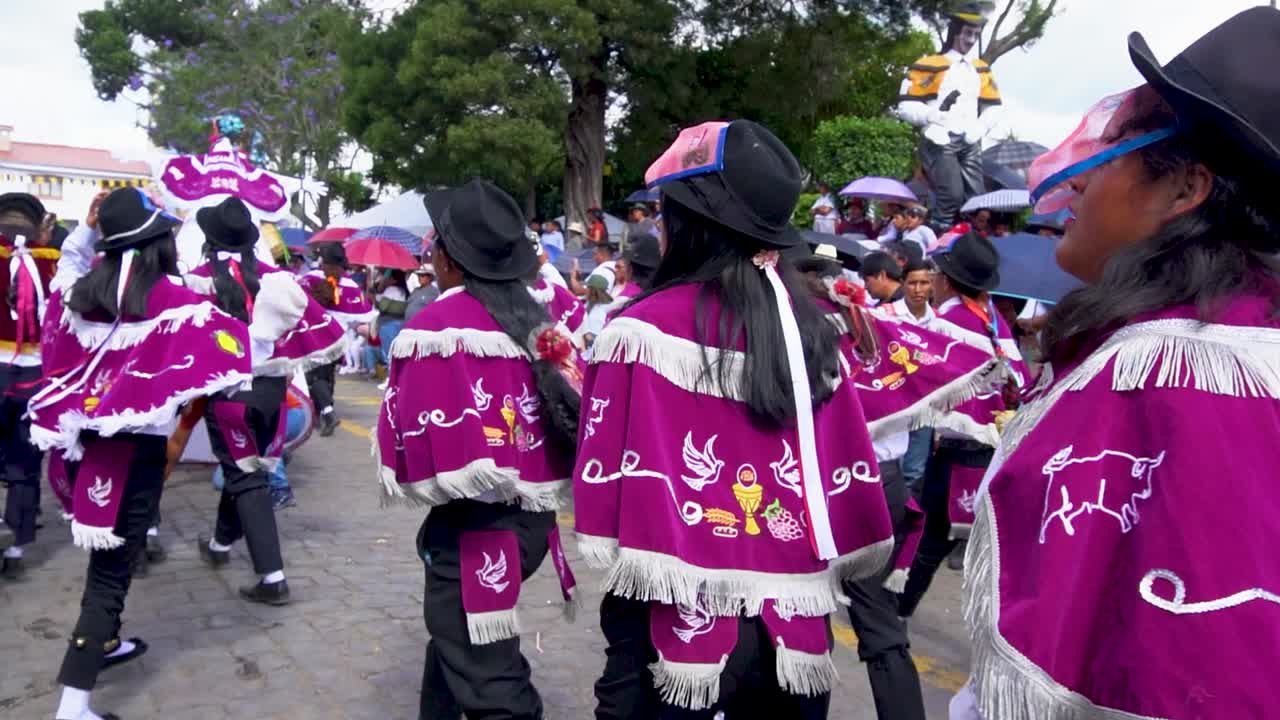 Slow motion shot of traditional folk dancers dancing on streets of Huancayo, Peru. Andean Festival.