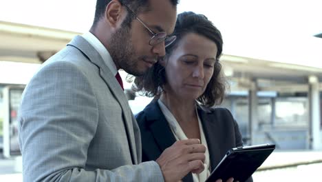 serious business colleagues using digital tablet