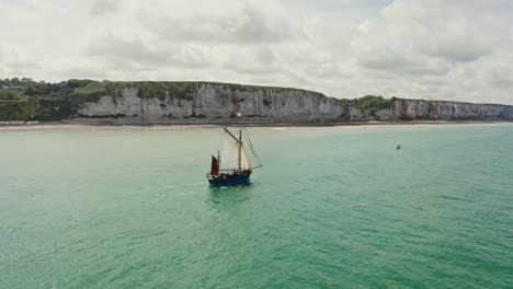 sailing ship near cliffs in normandy