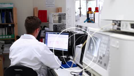 animation of circles spinning over male scientist using computer