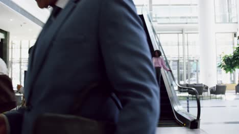 businessman using mobile phone in the lobby at office 4k