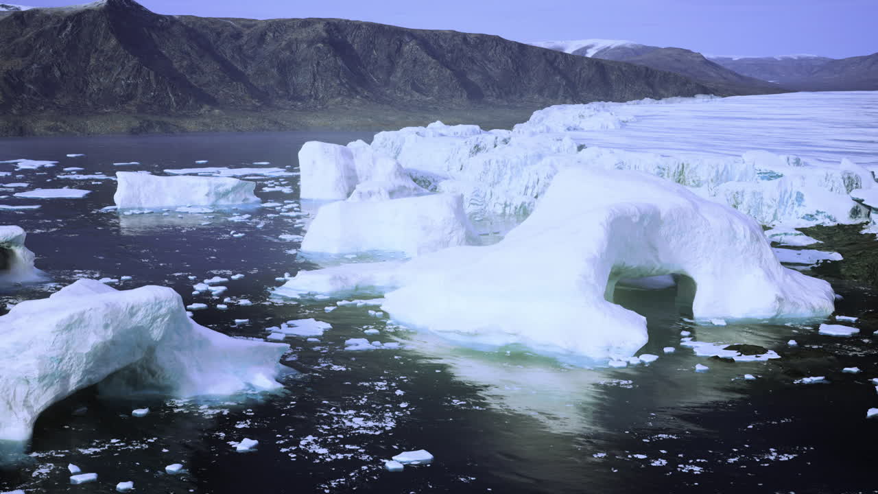 Icebergs floating in calm waters of greenland during a clear day