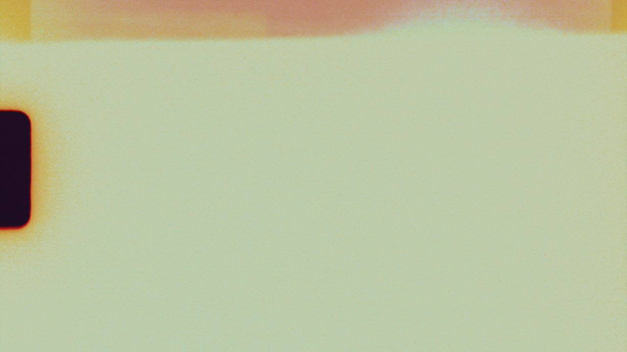 Textured super 8mm film frame with retro color burn and film grain