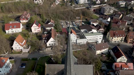 aerial views of a historic church tower and surrounding town