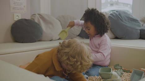 little kids with wooden cubes