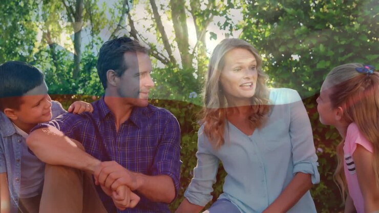Animation of chilean flag over happy caucasian parents, son and daughter in sunny forest