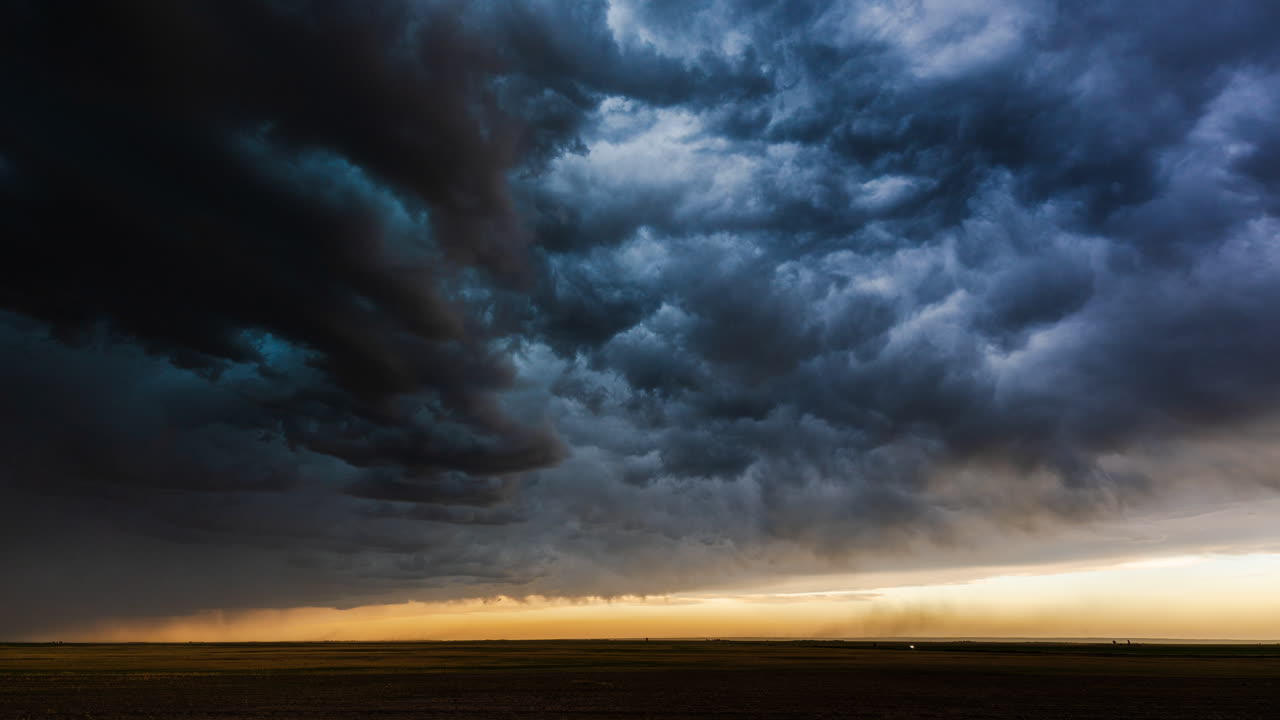 Moody horizon with dark storm clouds and rain filled sky creating dramatic weather texture