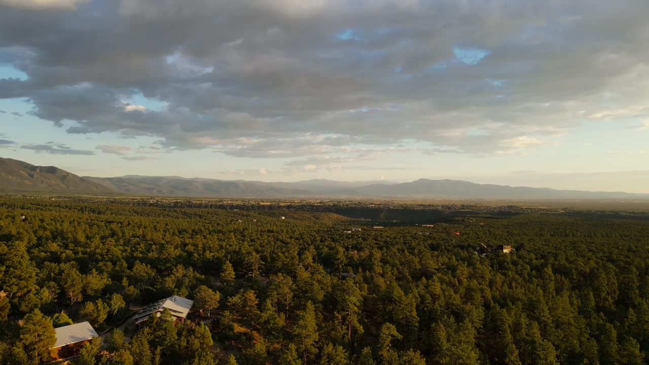 Drone flying over trees at sunset in New Mexico