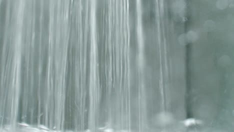 close up of a water jet filling a tank with water