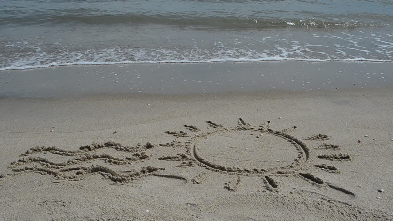 Sun drawing on the beach. Beach and drawing
