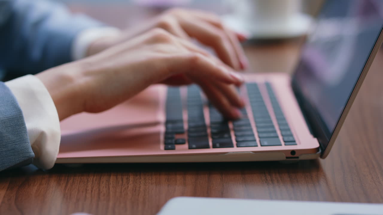 Girl hands writing laptop working remotely close up. Woman typing on computer.