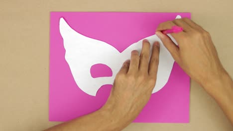 drawing on pink diamond foam using mold, making carnival mask with your hands