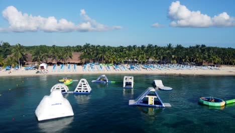 aerial view of cozumel beach with inflatable games