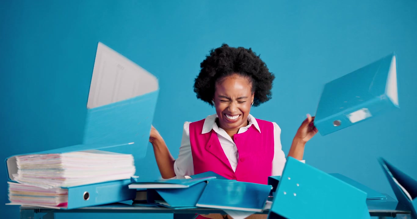 Stressed Businesswoman Throwing Files and Documents Off Desk