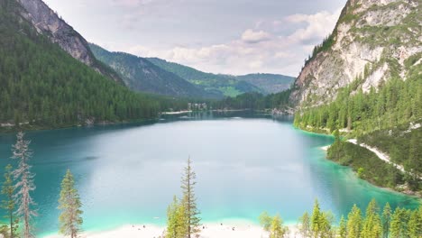Ripple-free-secret-beach-of-Pragser-Wildsee-Italy-lake-aerial