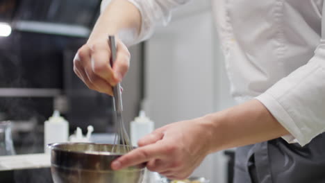 chef cooking in bain marie