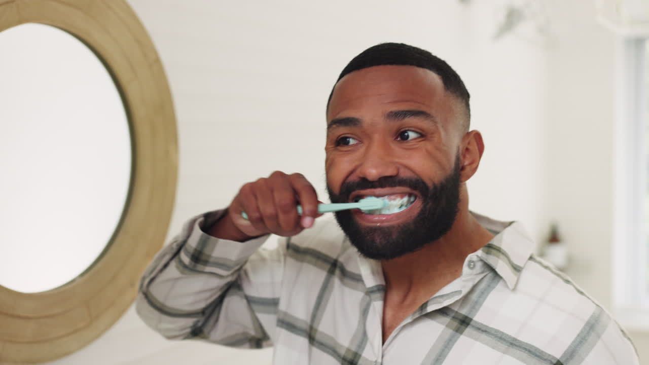 Black man, brushing teeth and mirror in bathroom