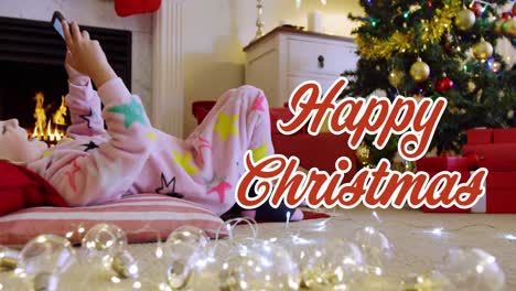 animation of season's greetings text over caucasian boy in christmas living room