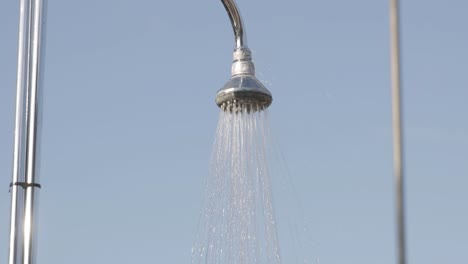 Water-goes-through-the-shower,-outside-shot