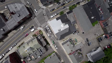 aerial view over the townscape of plymouth, usa - rotating, overhead, drone shot