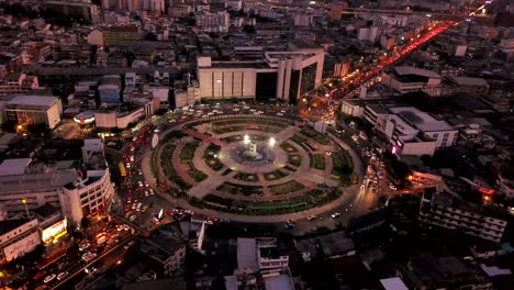 wongwian yai roundabout. aerial view of highway junctions. roads shape circle in structure of architecture and technology transportation concept. top view. urban city, bangkok at night, thailand.