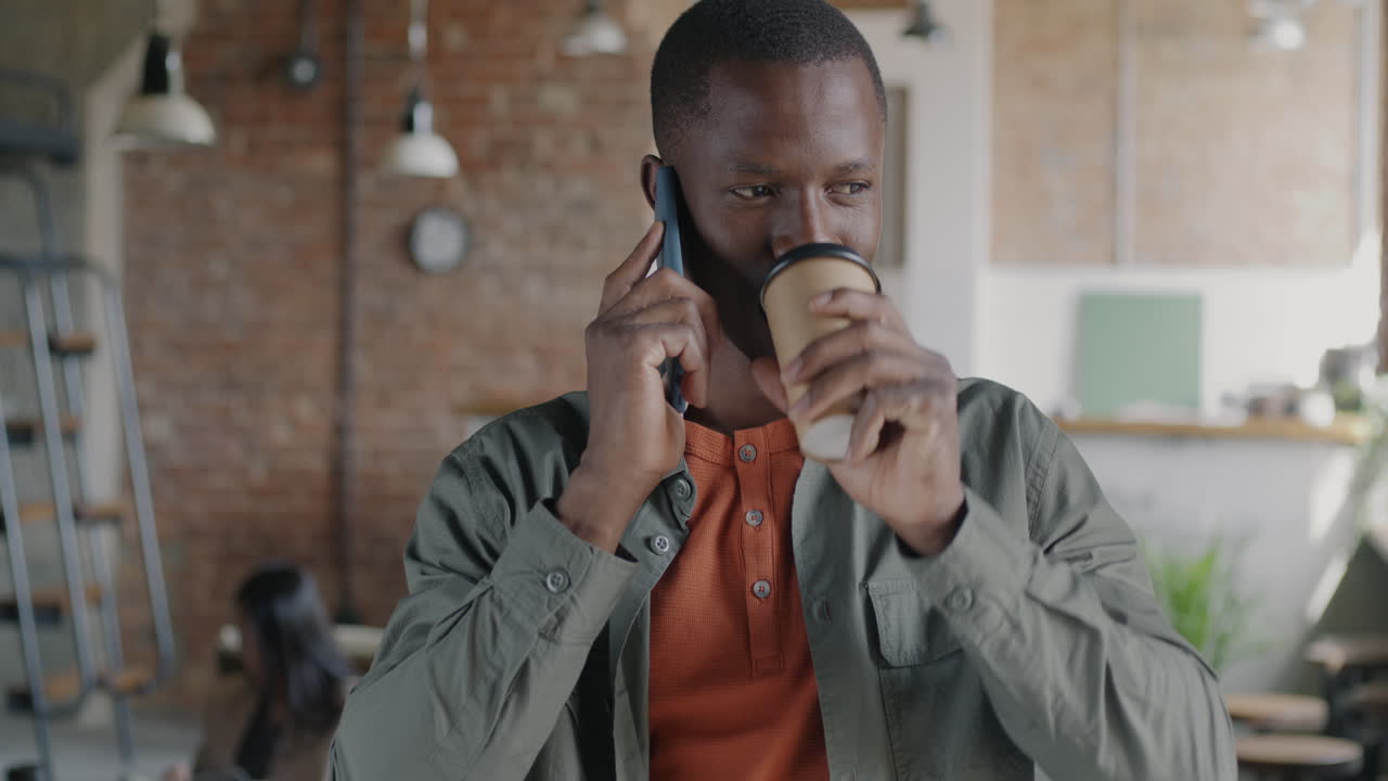 Man talking on phone in a modern office