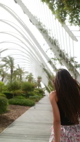 woman walking in a modern city park