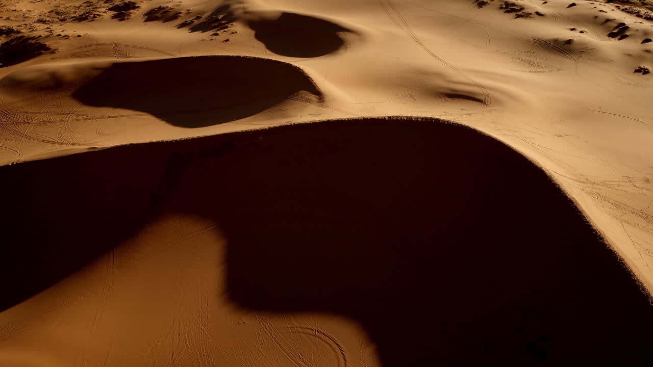 Aerial shot shows the otherworldly textures and soft colors of southern Utah’s pink dunes.