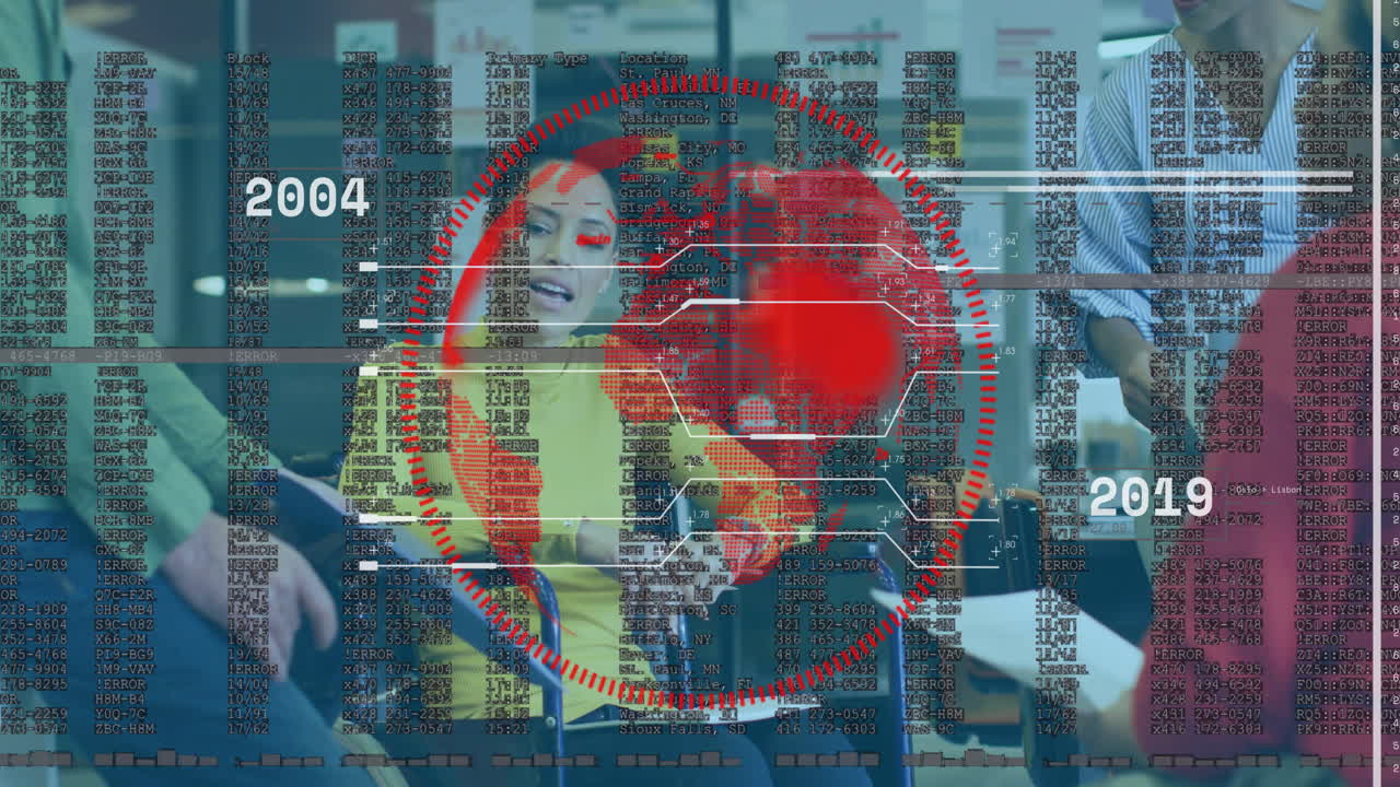 Colleagues collaborating in office tech, showing red scan ring with hex nodes and scrolling code