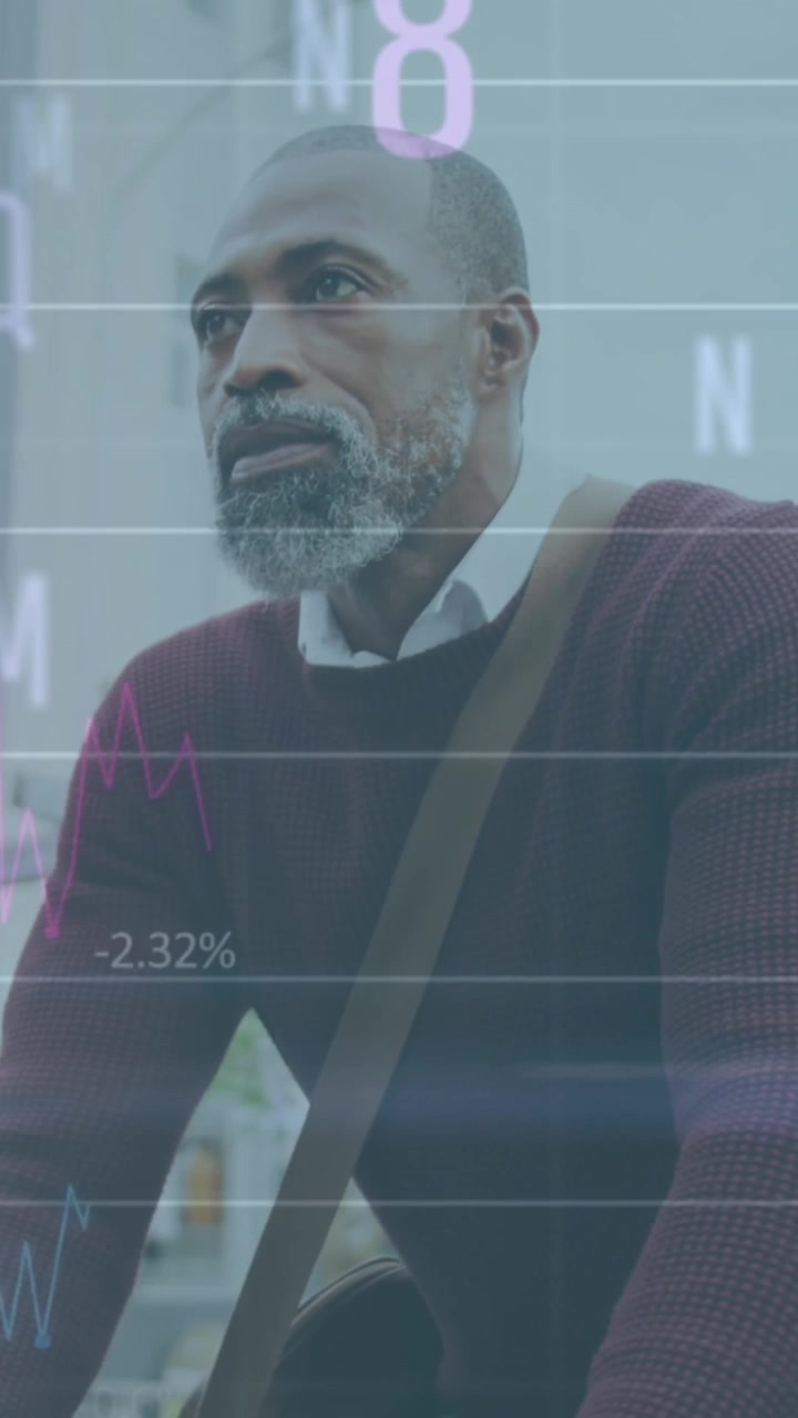 Animation of graphs, letters, changing numbers, senior african american man riding bicycle in city