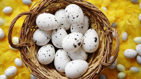 Easter-holidays-concept--White-dotted-chicken-Eggs-in-the-wicker