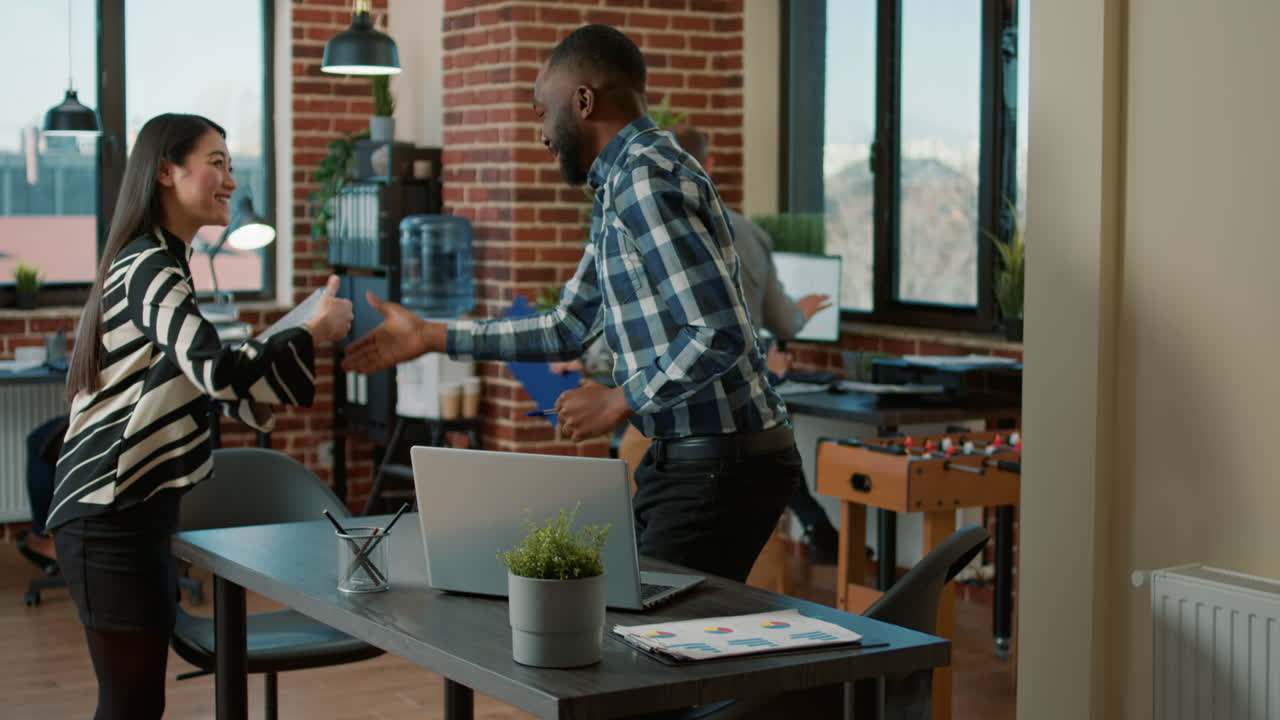 African american candidate meeting with asian recruiter